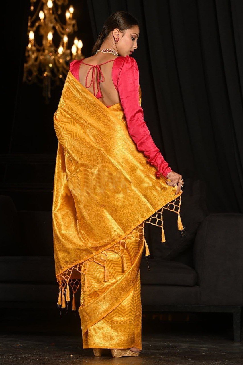Yellow banarasi weaving silk saree with beautiful tassel
