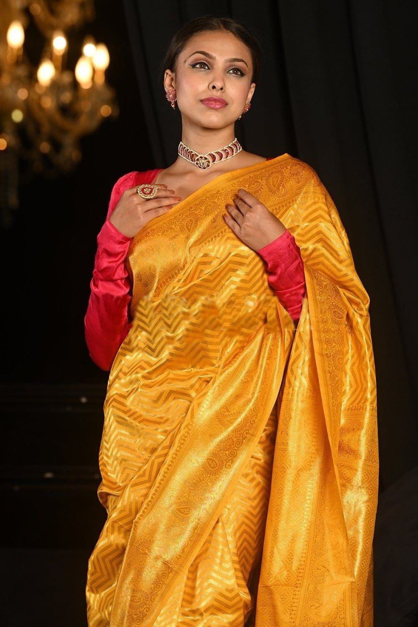 Yellow banarasi weaving silk saree with beautiful tassel